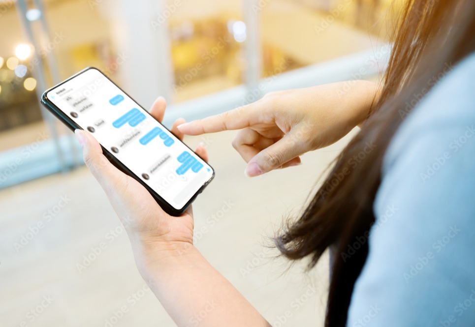 a woman text a message on phone