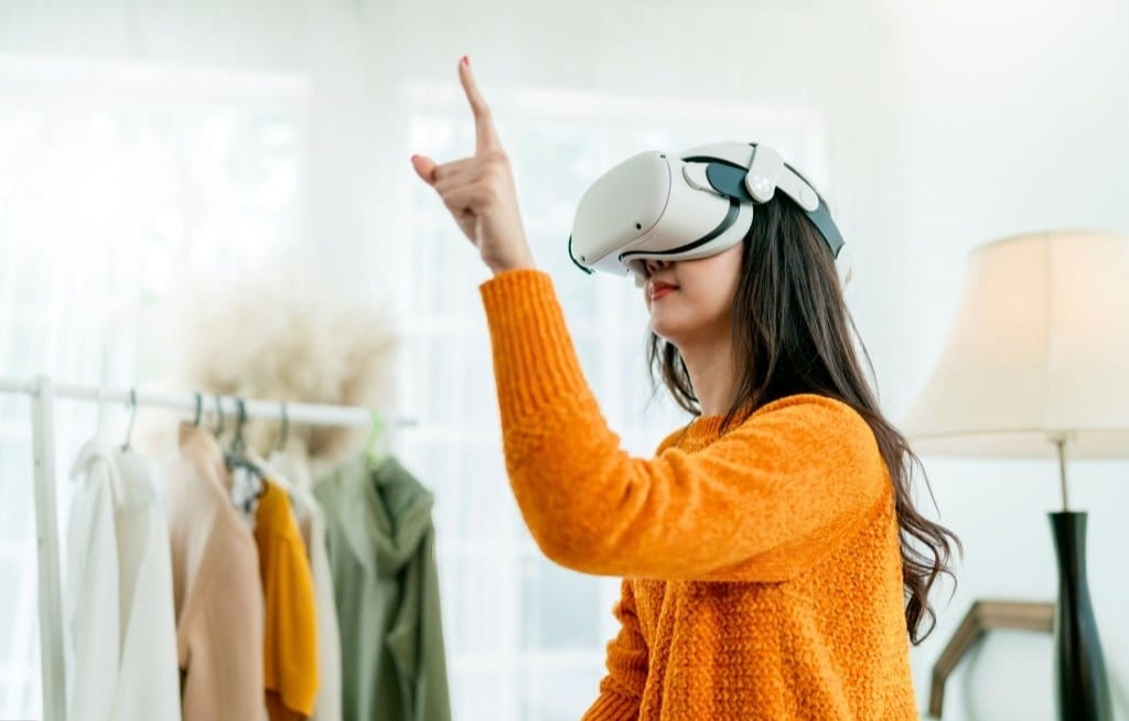 a woman wear VR device pointing 